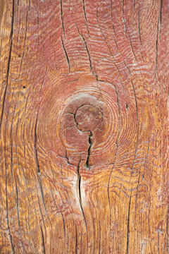 Close up texture of old weathered wood pillar with natural knot and cracked pattern in traditional Korean building.