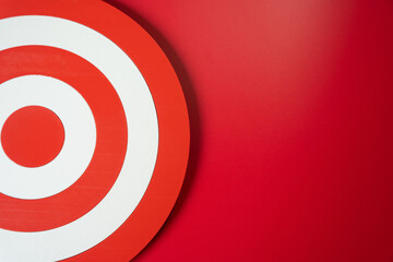 Target circle on a red background. Goal and planning concept. Marketing and targeting help define...