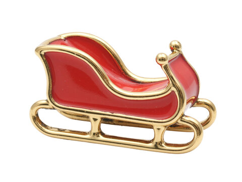 Red santa sleigh pin with curved gold runners, isolated on transparent background