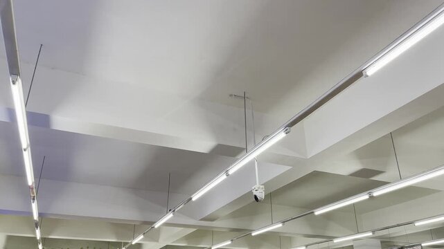 Industrial fluorescent ceiling lights interior stock footage