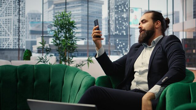 Anxious boss criticizes an ineffective team on a video call while dissatisfied with paperwork and throwing documents during business conflict and bad criticism.