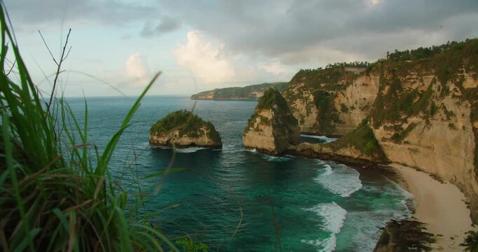Scenic view of rock formations in turquoise ocean at Diamond Beach in Nusa Penida Bali