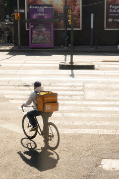 Mexico city, mexico, 03 19 2026, didi food courier bicycling urban street in mexico city