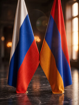flags of russia and armenia standing side by side in a room emphasizing close diplomatic ties and allied relations