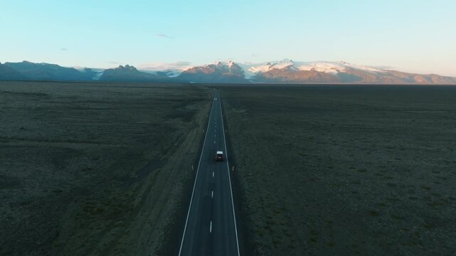 Empty Straight Road Toward Distant Mountains, Iceland Aerial