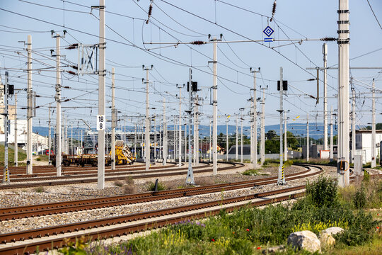 Curving railway tracks with overhead catenary wires