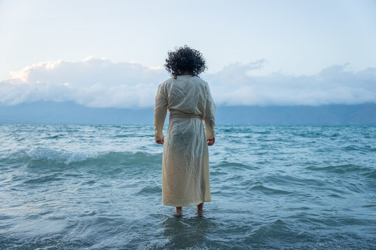 Jesus walks on water, divine miracle, biblical scene.