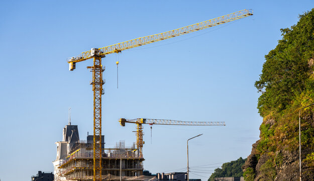 Construction crane, construction site yellow crane