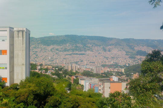 Medellin city panorama overlooking urban buildings and andes mountains