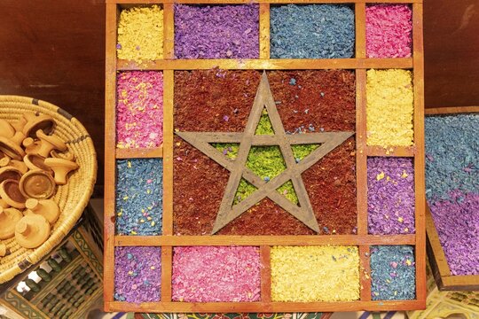 Vivid textile decor with a central star motif surrounded by a patchwork of colorful patterns