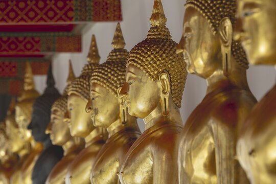Gilded Buddha statues (Bhumispara-mudra: Gautama Buddha at the moment of enlightenment), Wat Suthat Thepwararam, Royal Temple, Phra Nakhon, Bangkok, Thailand