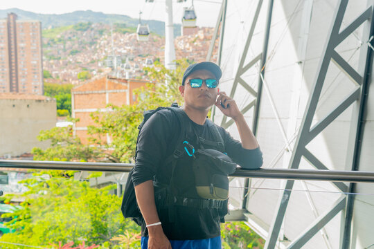 Traveler enjoying view from metrocable station in medellin