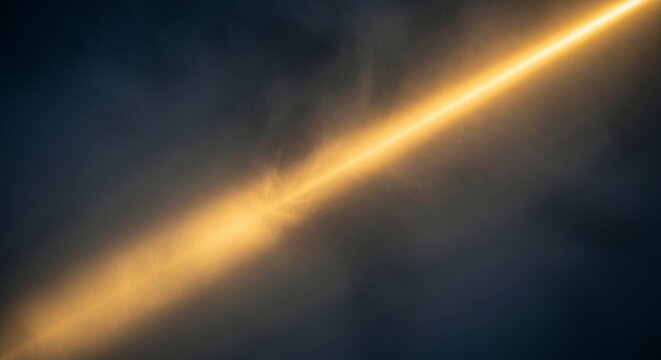 A dense layer of ethereal soft mist fills the frame while a single brilliant beam of golden light cuts through the hazy dark center, beam, magic, outdoor