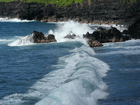 Ocean Waves Crashing Against Volcanic Rocks at Kehena Beach, Hawaii