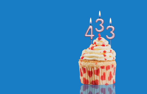 Birthday Or Anniversary Cupcake With Lit Candles; Candles Forming The Number 433