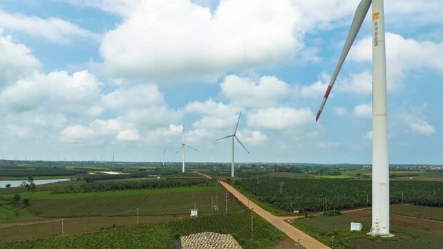 Wind farm under the blue sky and white clouds of the Baltic Sea in Xuwen County, Zhanjiang, Guangdong