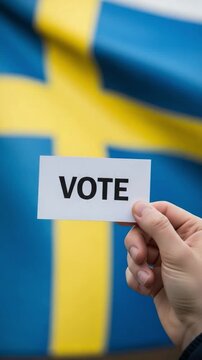 Swedish election vote concept with ballot paper held by hand in front of national flag for political participation and democracy