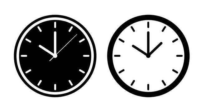 Pair of analog wall clocks displaying different times side by side in black and white.