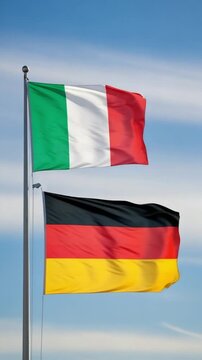 Italian and German flags waving on flagpoles against a blue sky, representing European partnership, diplomacy, and international relations