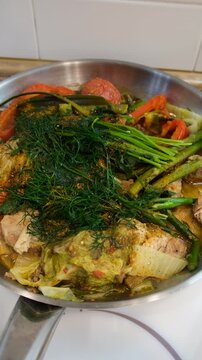 A dish of stewed vegetables in a frying pan. Selective focus.