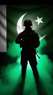 Silhouette of a Pakistani male soldier in military uniform standing proudly in front of the national flag with glowing green smoke representing patriotism and defense