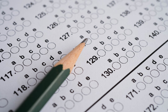 Answer sheets with pencil drawing fill to select choice, education concept.