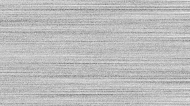 Glitch tv static noise screen overlay with flickering horizontal grain video effect.