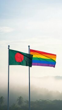Bangladesh flag and pride rainbow flag flying together outdoors representing LGBTQ rights and national equality