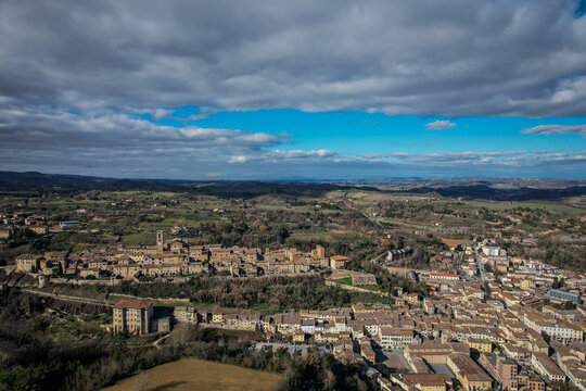 Aerial View of Colle di Val d'Elsa, Tuscany, Italy under Dynamic Cloudy Sky