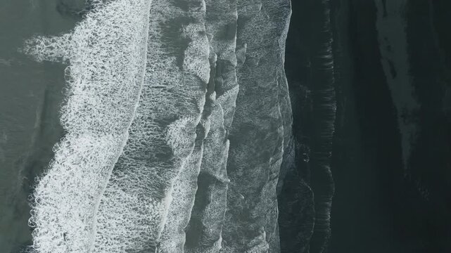 Top-Down Aerial of Waves Hitting Black Cliffs, Iceland