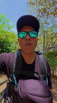 Male tourist vlogging riding the medellin metrocable