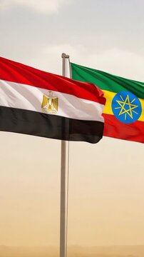 Flags of Egypt and Ethiopia fluttering on flagpoles representing African international relations diplomacy cooperation and geopolitical tensions