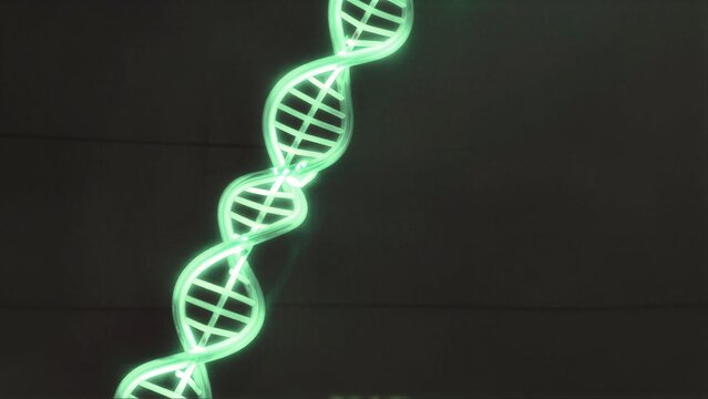 Luminous green DNA helix glowing against dark tiled background.