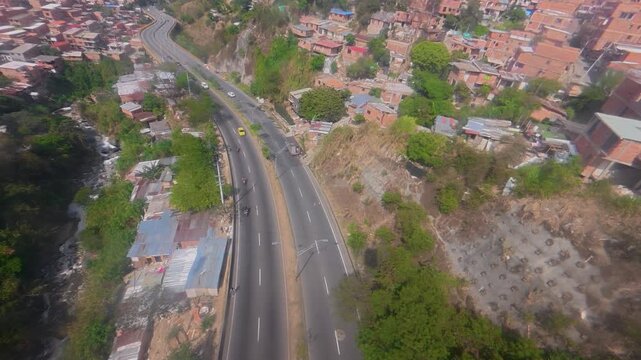 Metrocable gondola lift trip over medellin highway