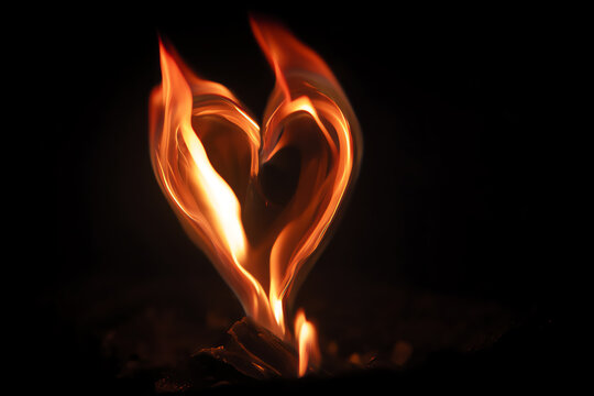 Heart of Flame: A vibrant heart shape formed by dancing flames against a dark, mysterious backdrop, symbolizing passion, love, and intense emotion.
