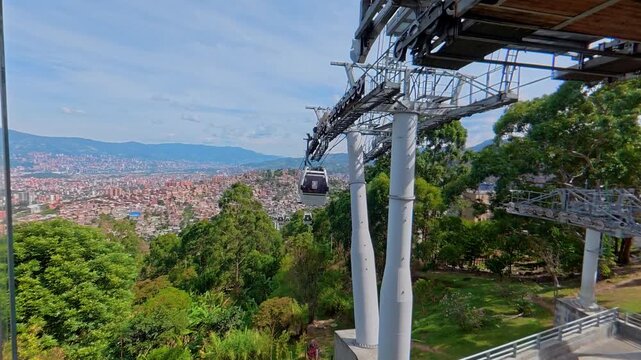 Cable car gondola arriving at station in medellin colombia
