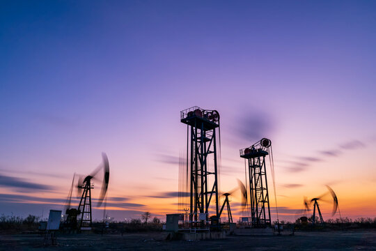 The silhouette of oilfield derrick