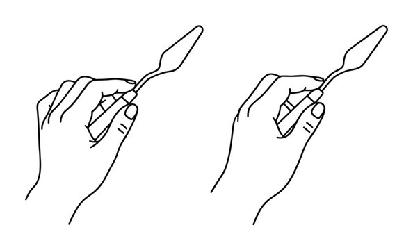 Hand holding spatula for painting or cooking isolated on transparent background.