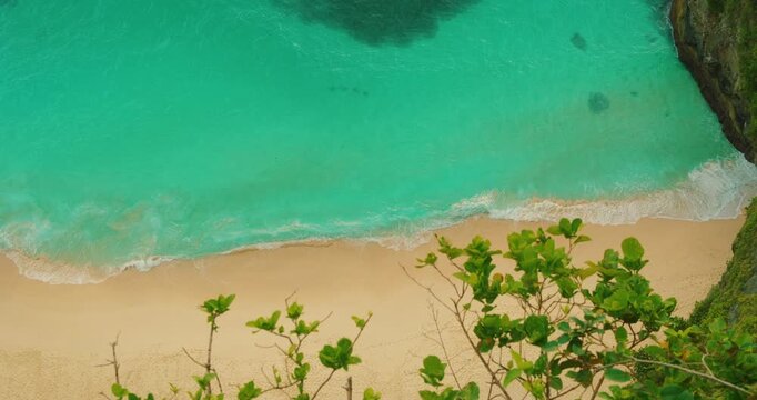 Coastal scene with clear ocean water meeting soft sandy beach Beach Nusa Penida Bali