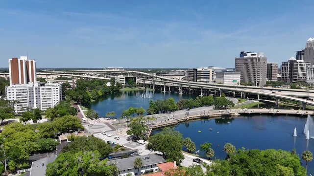 View looking over Lake Lucerne and the downtown Orlando skyline with condo and business buildings in Orange County, Orlando, Florida, USA.