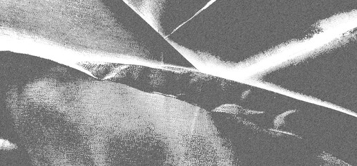 Obraz premium High contrast black and white abstract fabric texture with strong shadows.