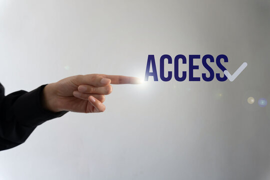 Human hand gestures toward text 'ACCESS', implying authorization or entry