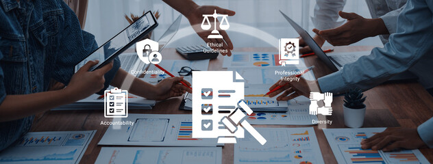 A diverse business team engages in conversation about ethical standards and accountability,...