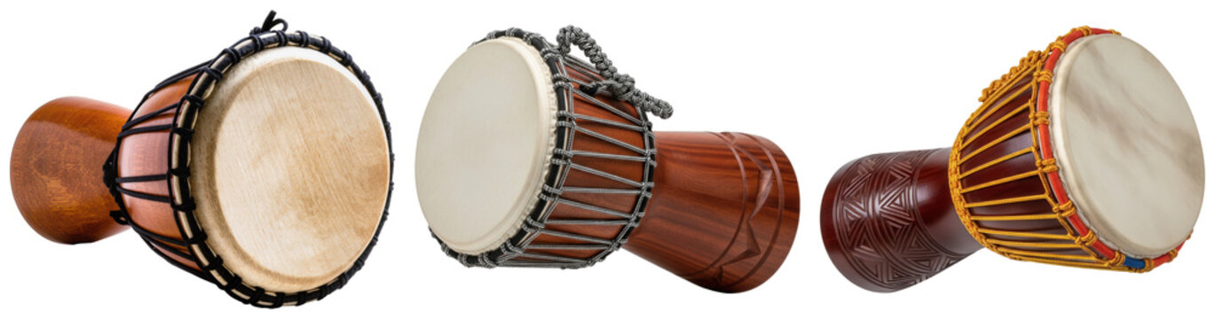 Three djembe drums of different sizes and designs, isolated on a white background