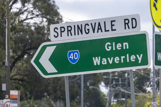 A green directional road sign pointing toward Glen Waverley&nbsp;along an urban transport corridor in suburban Melbourne,  Australia.
