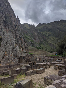 Ancient Inca ruins at the Ollantaytambo Archaeological Site in Cusco, Peru, featuring monumental stone terraces, walls, and remnants of Inca architecture in the Sacred Valley
