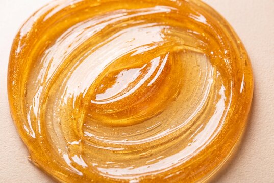 Golden Amber Depilation Wax Texture for Professional Hair Removal and Skincare Cosmetic Treatment