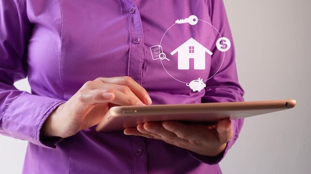 Close-up of a businesswoman interacting with her tablet, featuring an animation of a house icon surrounded by a circle of icons representing finance, keys, a piggy bank, and a legal document.