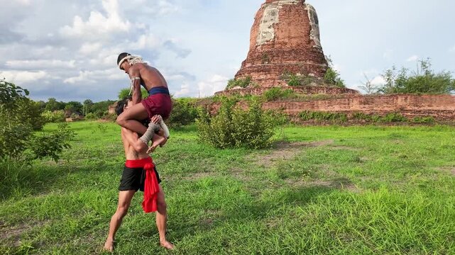Muay Thai Fighters Performing Acrobatic Martial Arts at Ayutthaya Historical Site