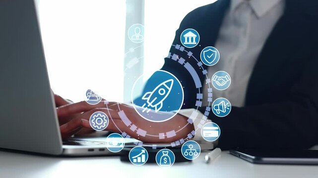 A person is typing on a laptop while surrounded by digital icons showing various business activities. The scene takes place in a bright office during daytime.